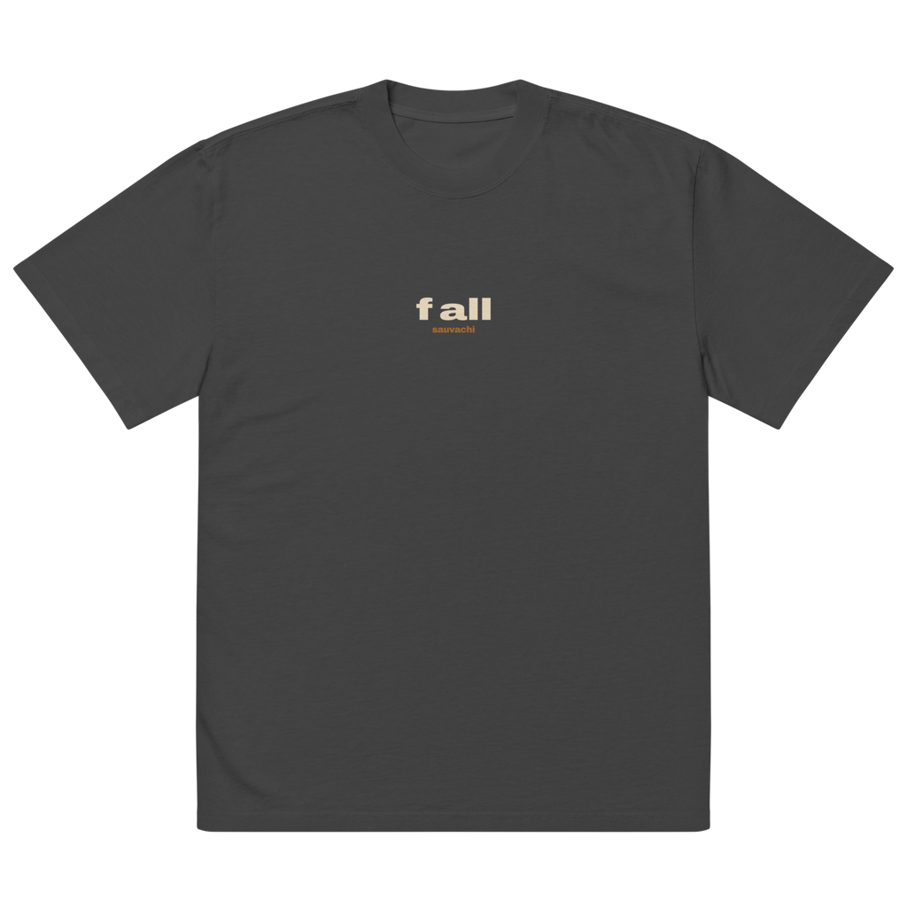 front of the faded black tee, laid flat: a small f all with sauvachi under it on the chest