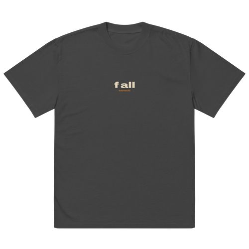 front of the faded black tee, laid flat: a small f all with sauvachi under it on the chest